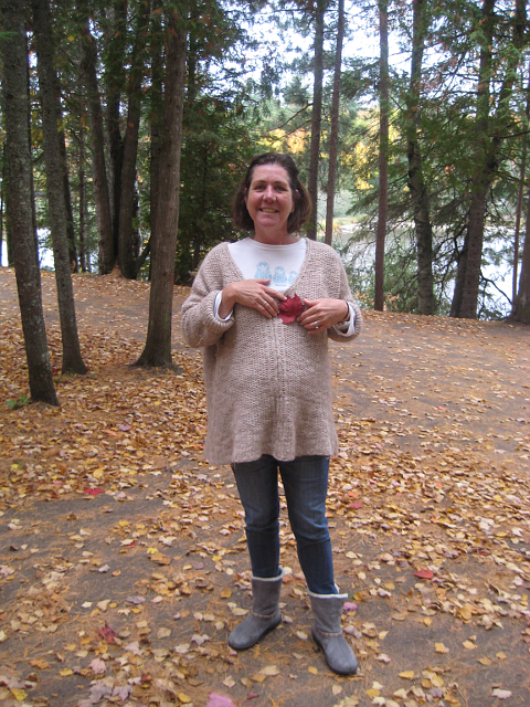 Woman holding red leaf