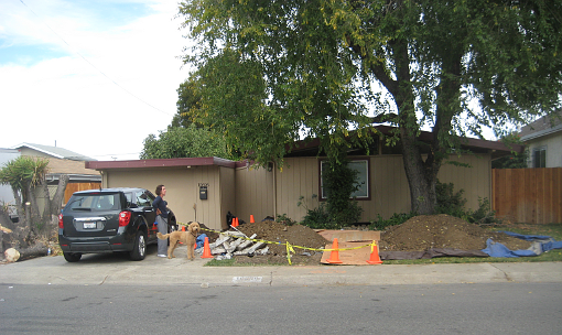 House with trench in front yard