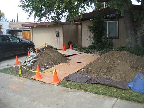 Trench covered with plywood
