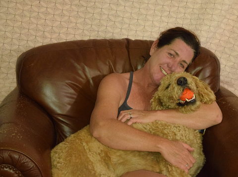 Woman with dog in chair