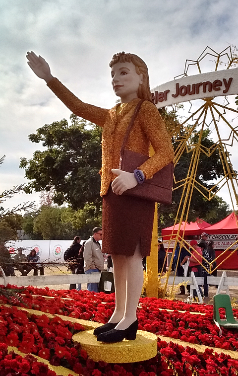 Businesswoman giving salute