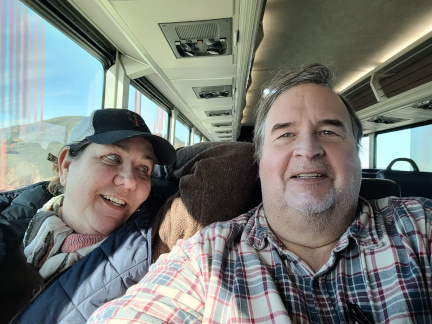 Happy couple riding bus