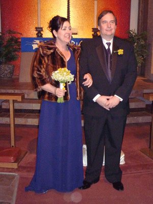 Bride and groom standing at alter