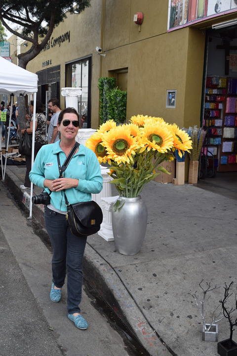 Stephanie smiling next to flowers