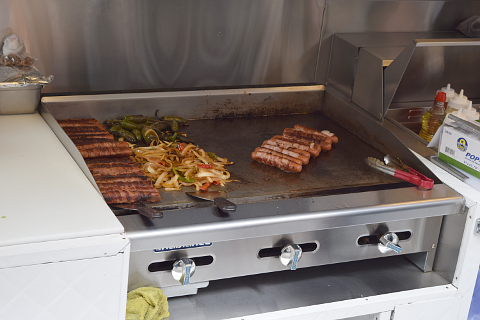 Hot dogs being grilled