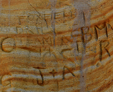 Sandstone with incised letters