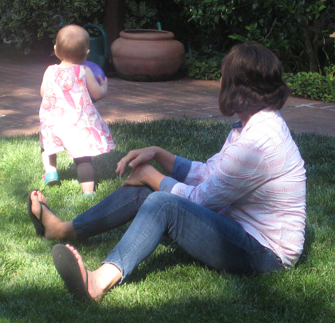 toddler running off with ball