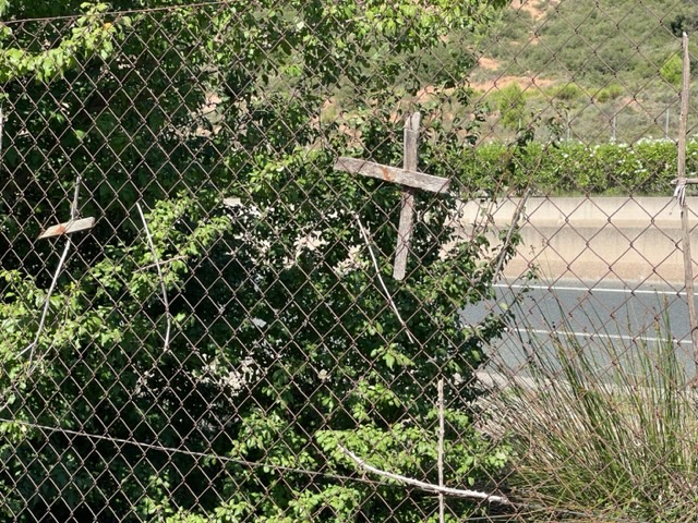 Cross on fence