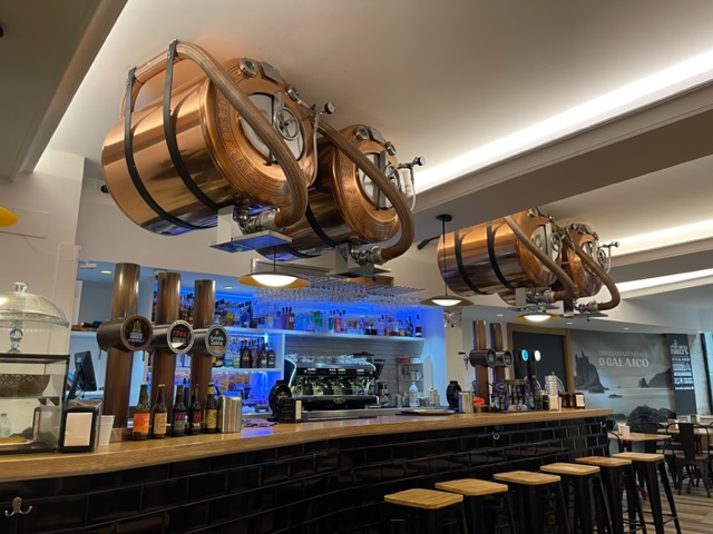 Copper barrels suspended from ceiling